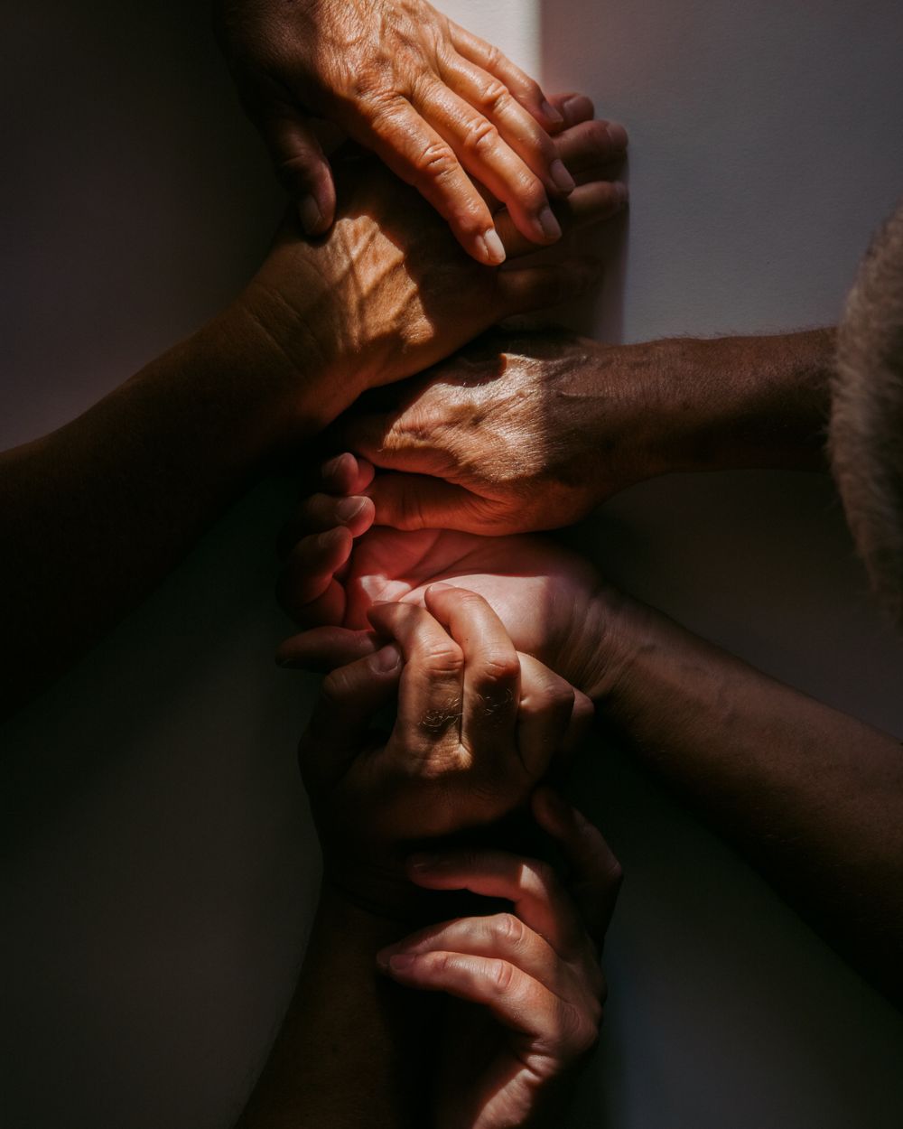 Hands clasped together in support